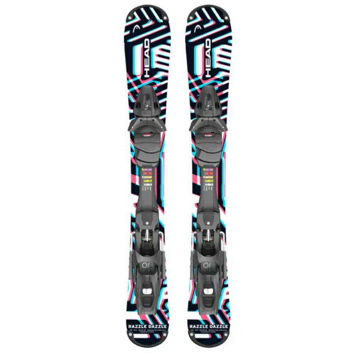 Pair of Head Razzle Dazzle junior skis featuring bold geometric graphics in blue, pink, and white with bindings, ideal for young skiers.